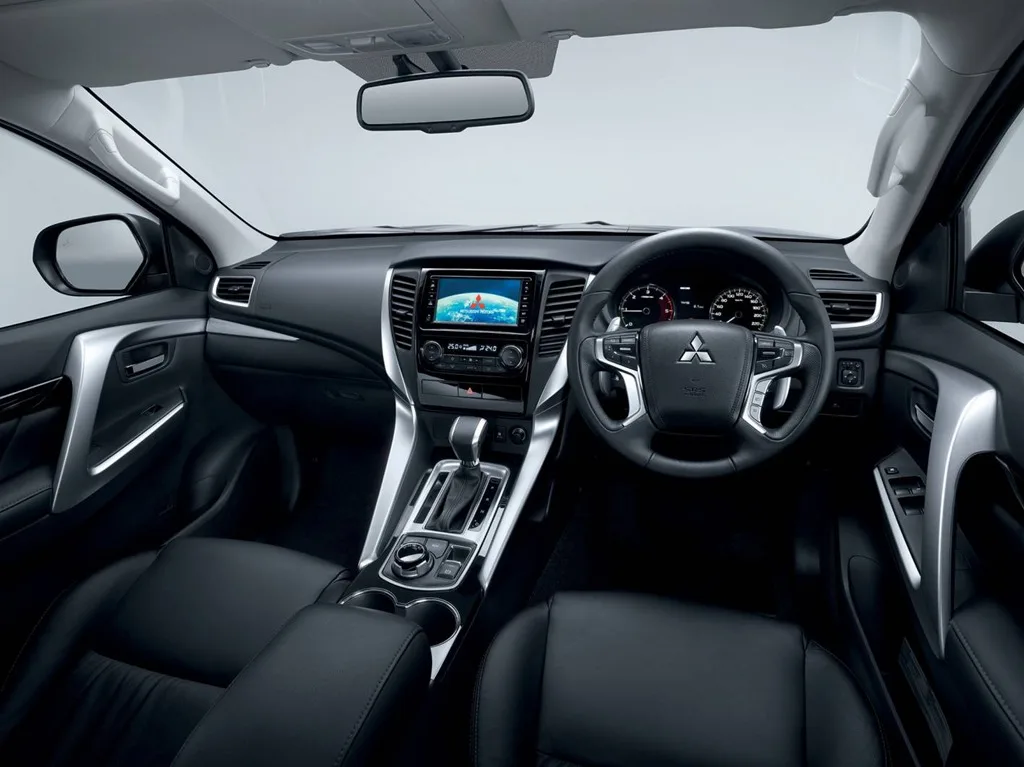 Mitsubishi Pajero Sport interior with right-hand-drive dashboard, centre screen and automatic gear selector