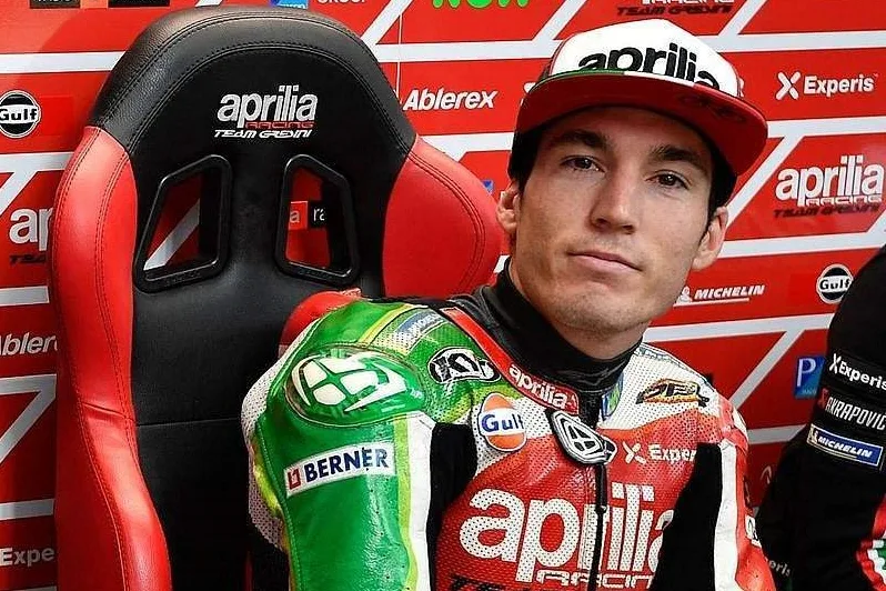 Aleix Espargaro on his MotoGP motorcycle during a racing event.