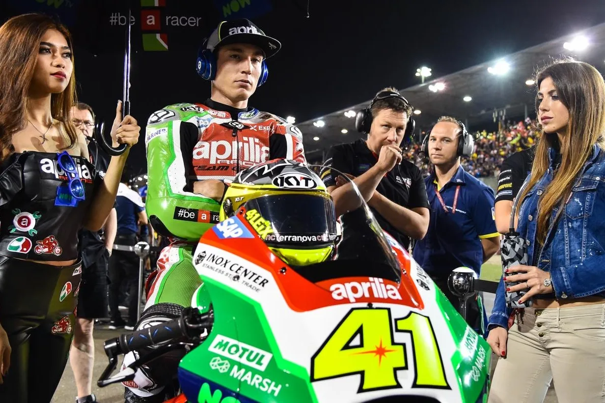 Aleix Espargaro on his MotoGP motorcycle during a racing event.
