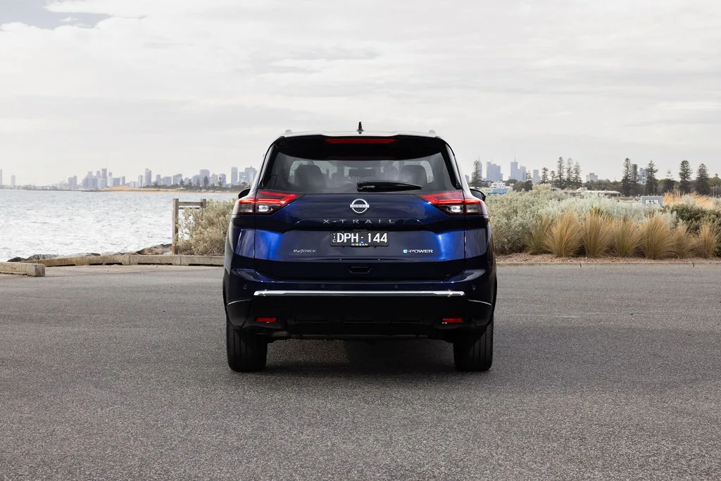2026 Nissan MY26 X-TRAIL Ti-L - Blue Exterior - Rear profile (grass)