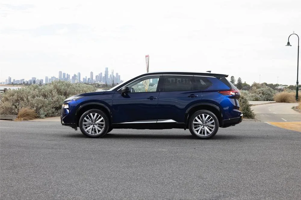 2026 Nissan MY26 X-TRAIL Ti-L - Blue Exterior - Side profile (grass)