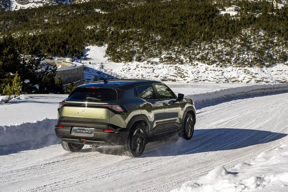 All New Suzuki E VITARA-EXTERIOR rear driving in mountain snow