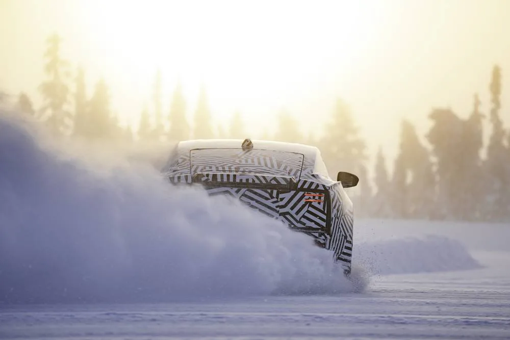 JAGUAR electric GT arctic testing rear kicking up snow