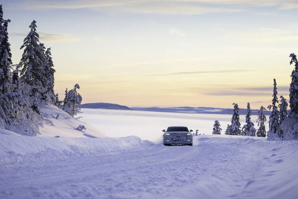 JAGUAR electric GT arctic testing front driving in heavy snow