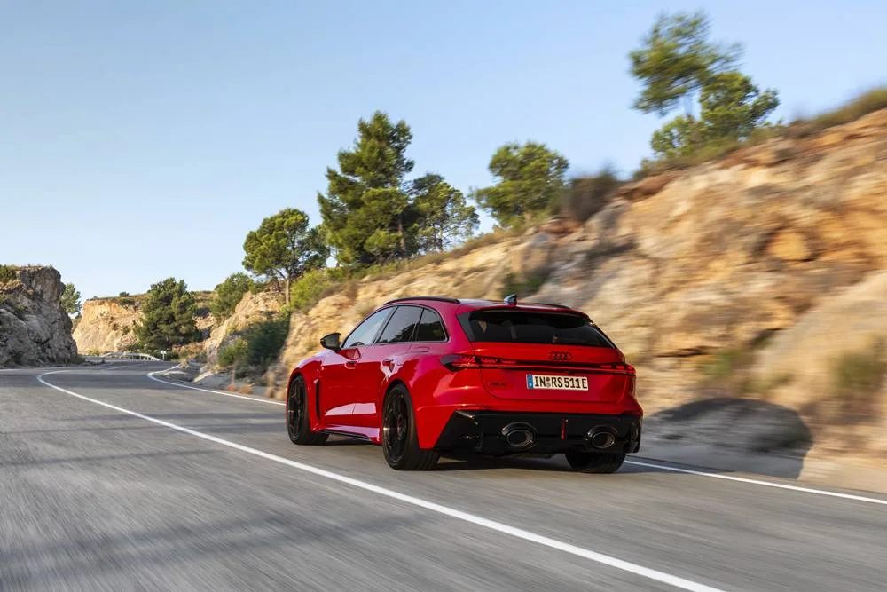 Audi RS 5 Avant phev driving rear3/4 view