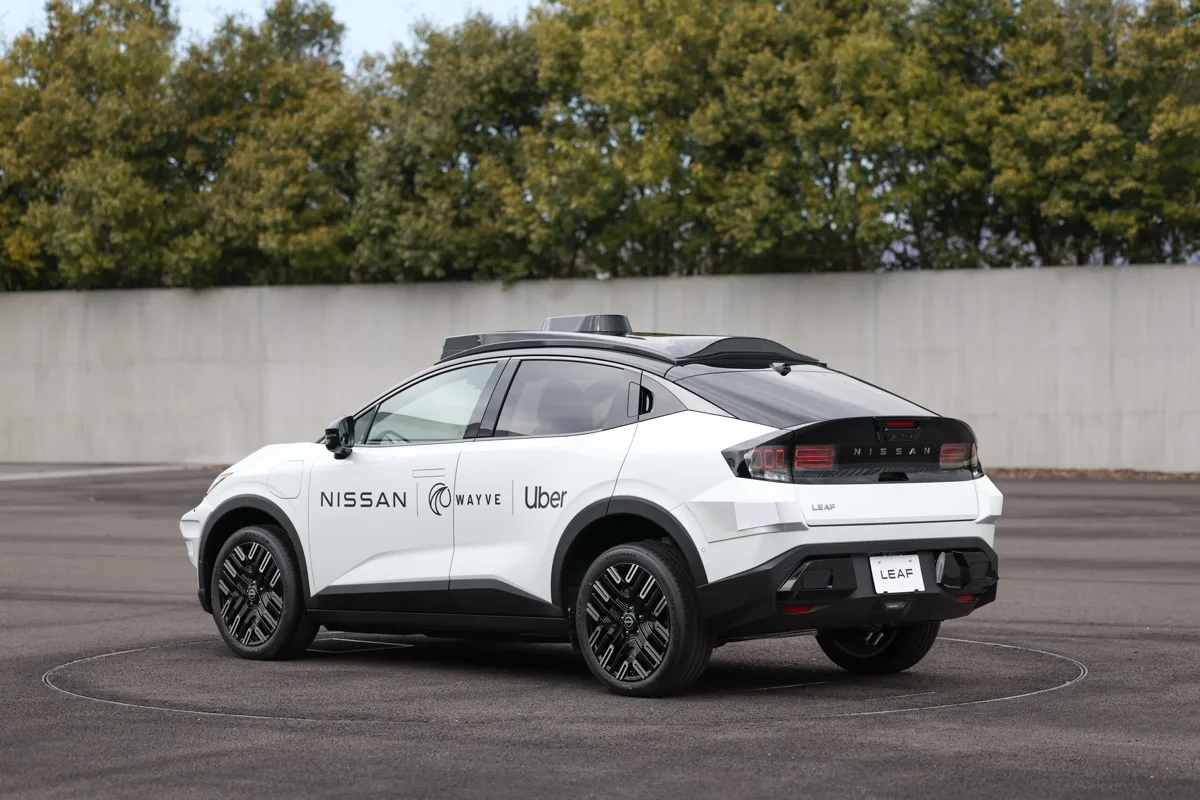 Nissan LEAF robotaxi rear three-quarter view showing taillights and NISSAN tailgate lettering