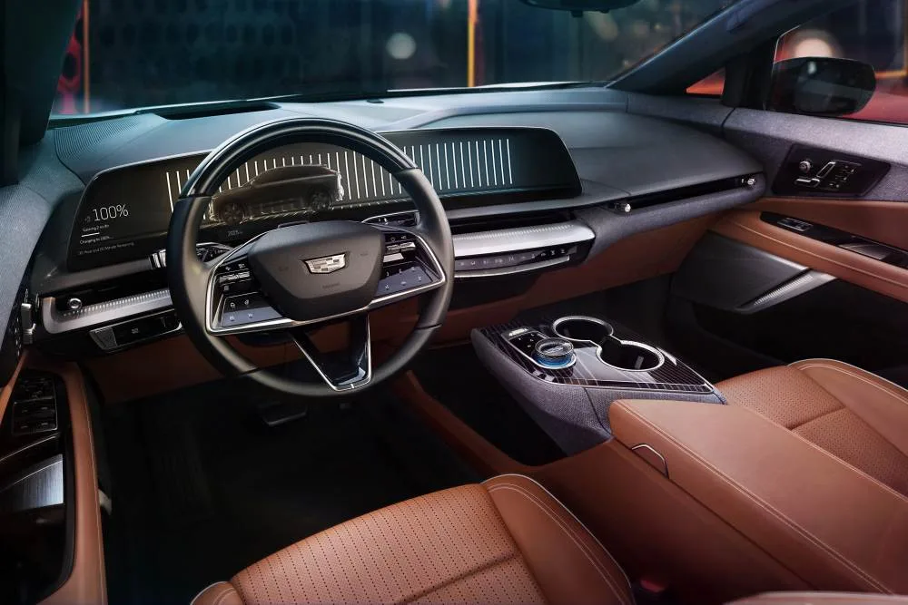 View of the 2025 Cadillac OPTIQ interior in Autumn Canyon, featuring the 33-inch-diagonal interface and display with 9K resolution.