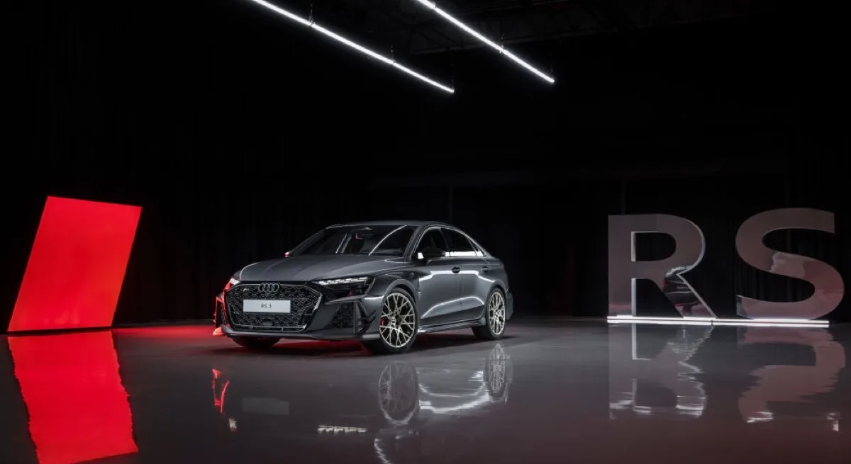 2026 Audi RS 3 competition limited in grey, studio front three-quarter view with dramatic lighting
