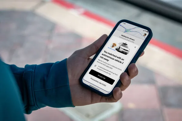 Uber app showing autonomous vehicle match notification for Motional robotaxi