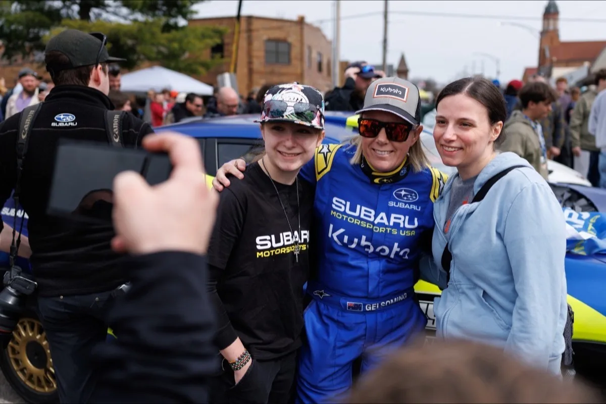 Rhianon Gelsomino posing with fans at rally service park