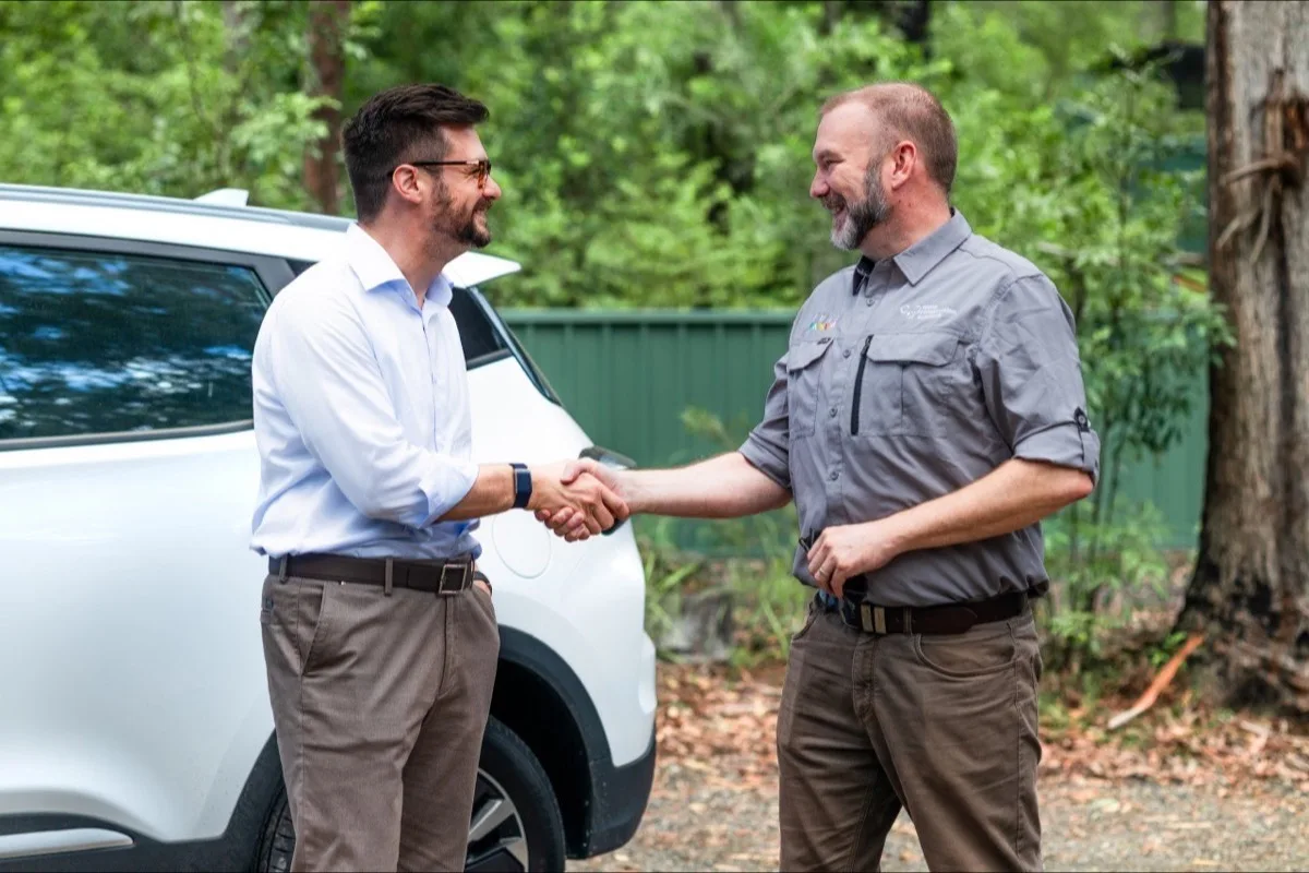 Chery Australia representative shaking hands with Koala Conservation Australia staff