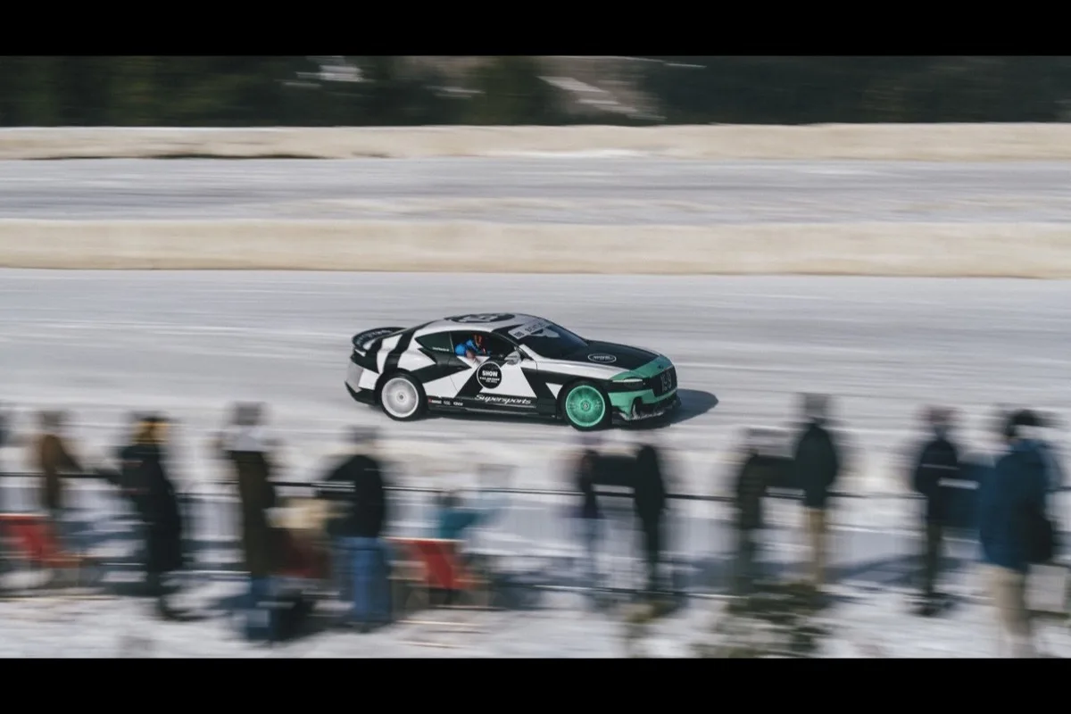 Bentley Supersports driven by Lia Block drifting sideways on ice at FAT Ice Race with spectators watching