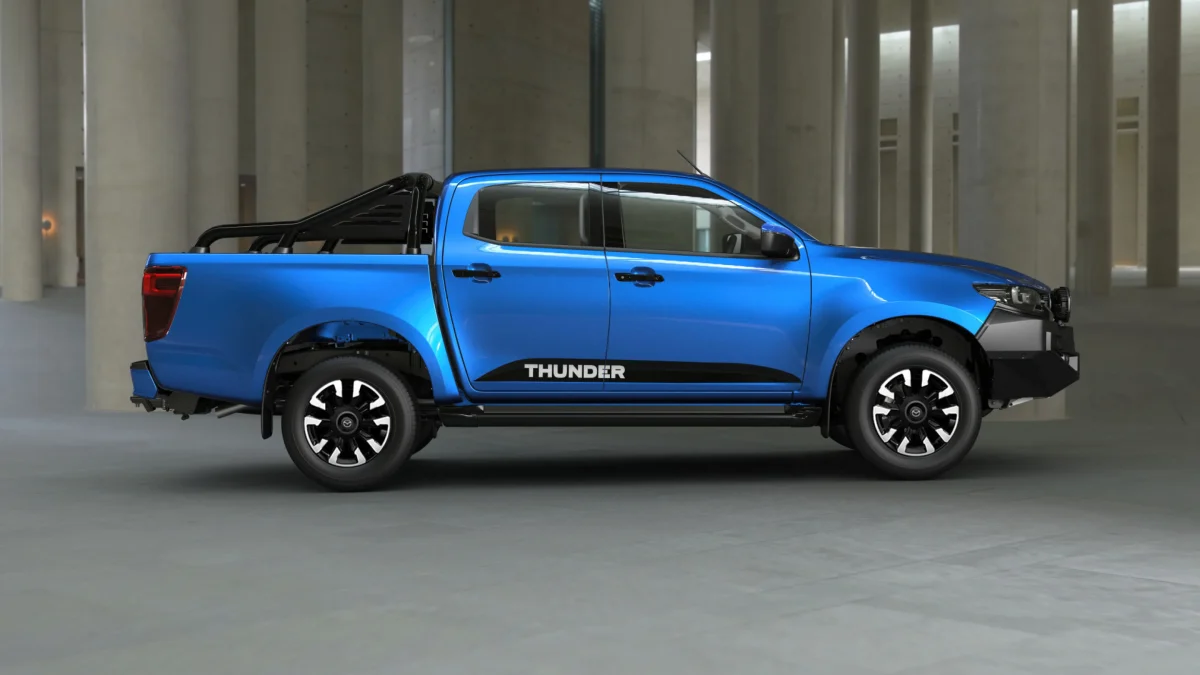 2026 Mazda BT-50 Thunder dual cab ute side profile in blue showing Thunder decals and black sports bar