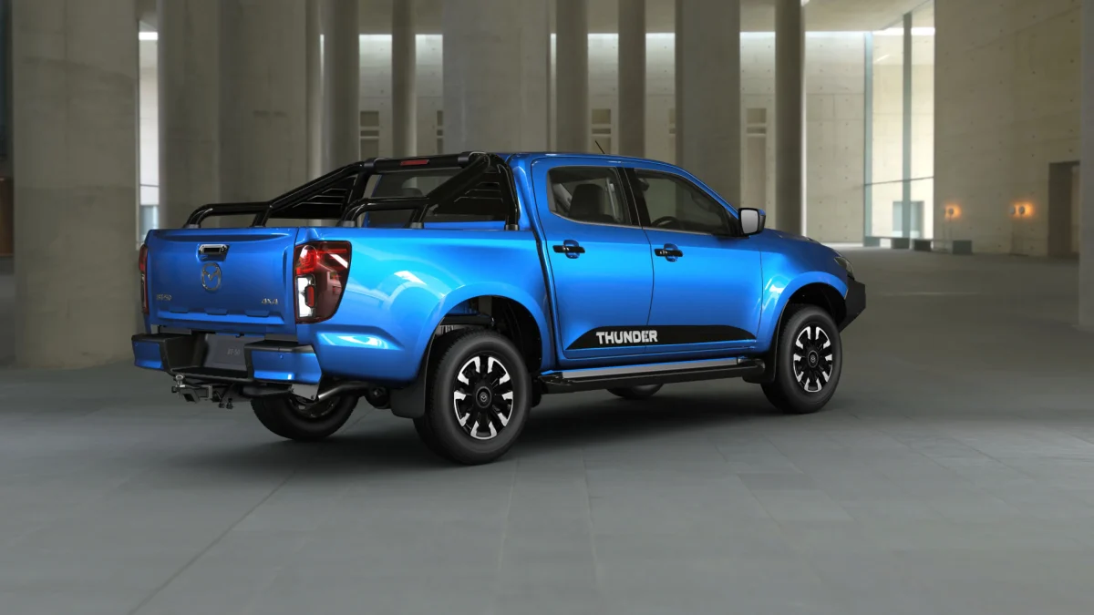 2026 Mazda BT-50 Thunder dual cab ute rear three-quarter view in blue with tow bar