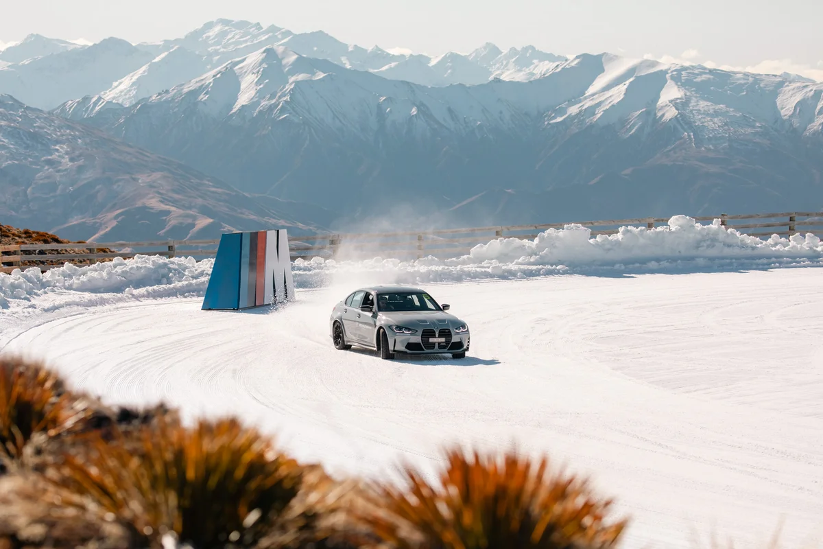 BMW M4 Competition rear view on frozen lake
