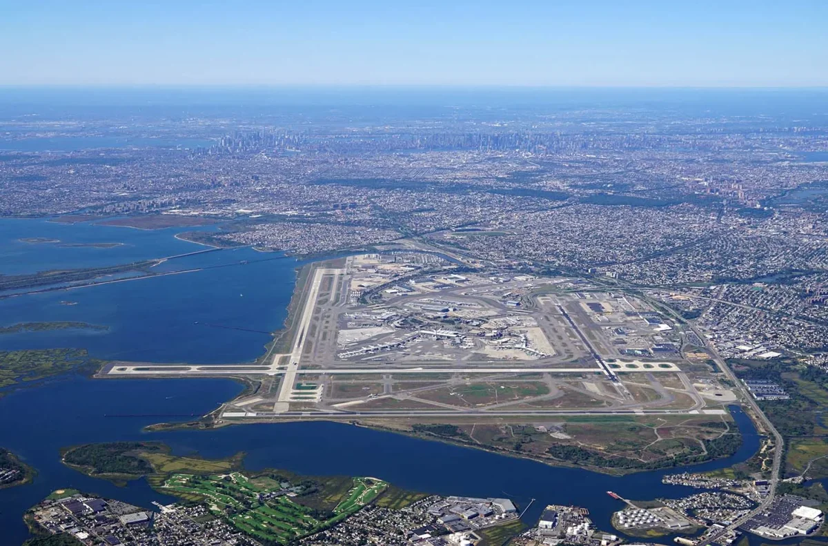 JFK Airport aerial view at dusk showing terminals and runways