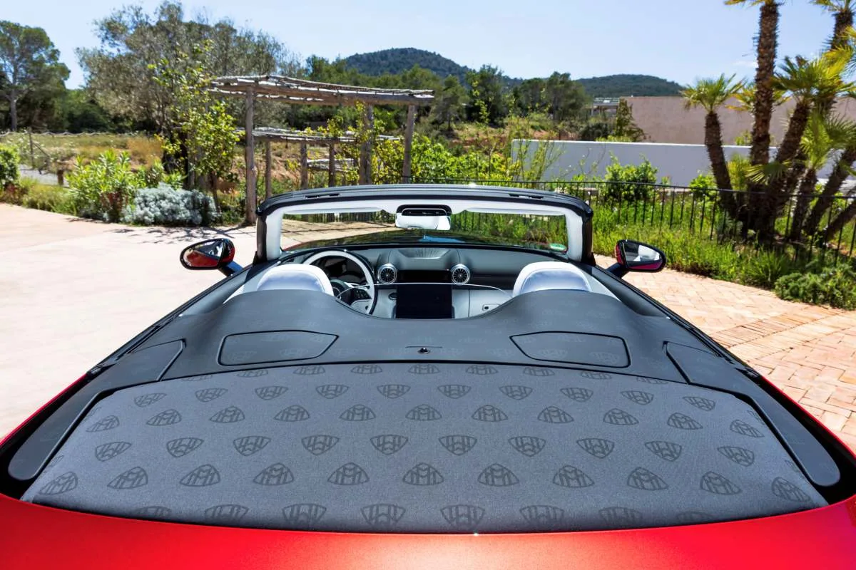 Mercedes-Maybach SL 680 red monogram foled roof fabric detail on a californian bungalow driveway