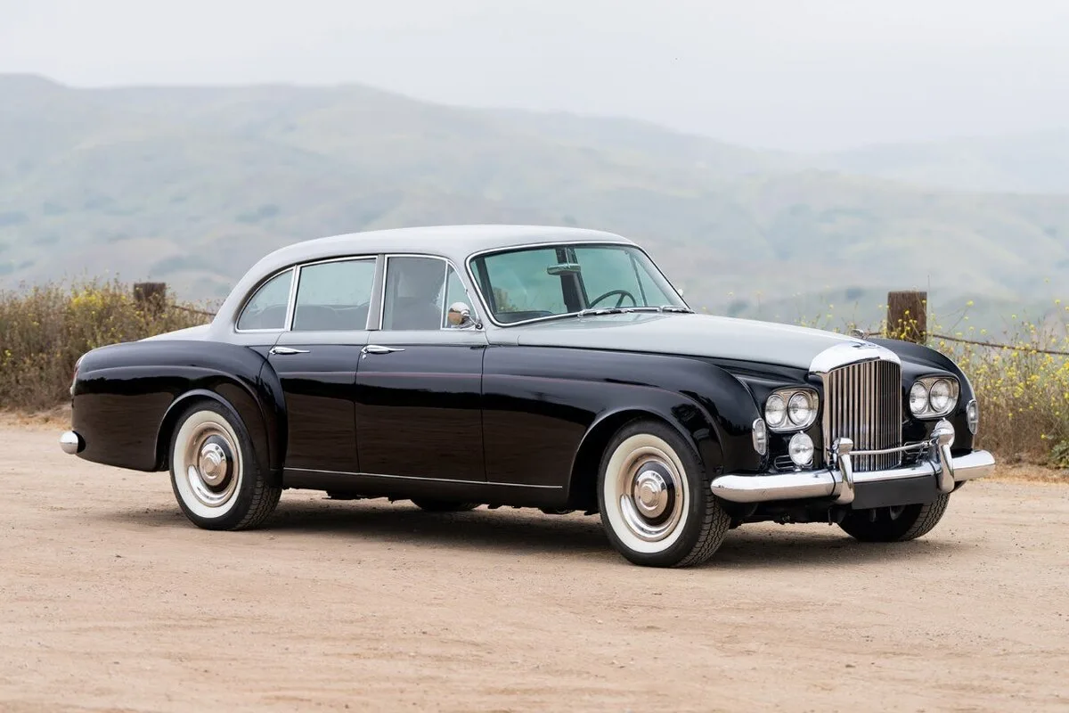 1963 Bentley S3 Continental Flying Spur in black with white roof on hillside road