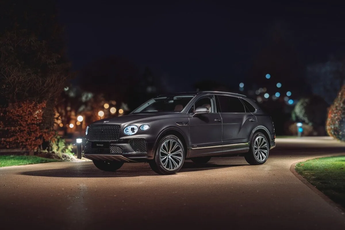 Bentley Bentayga EWB in Satin Anthracite Boodles Dark specification front three-quarter at night