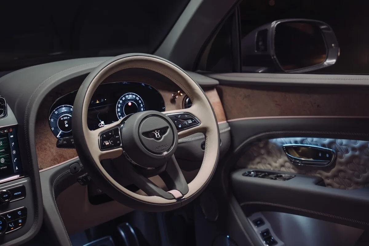 Bentley Bentayga Boodles interior showing steering wheel, dashboard and embossed door panel