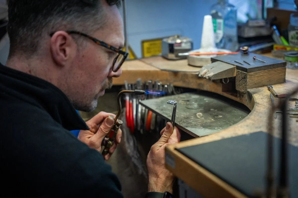 Boodles master jeweller hand-setting diamonds in the Be Boodles motif for Bentley