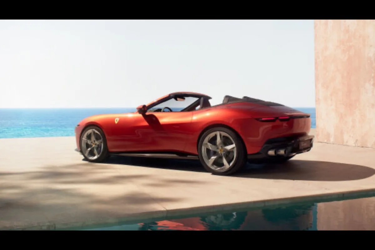 2026 Ferrari Amalfi Spider rear three-quarter view in Rosso Tramonto