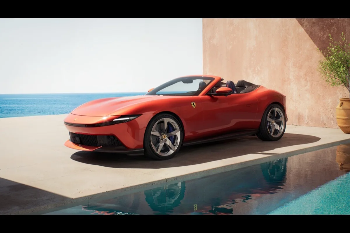 2026 Ferrari Amalfi Spider front three-quarter view by pool in Rosso Tramonto