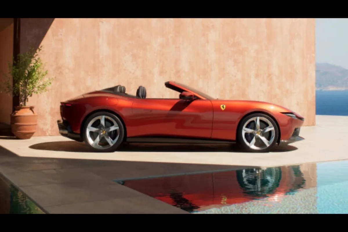2026 Ferrari Amalfi Spider side profile in Rosso Tramonto