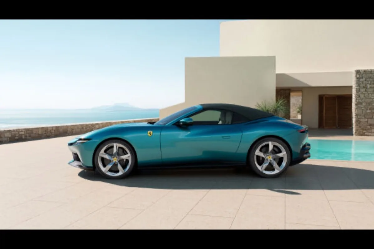 2026 Ferrari Amalfi Spider side profile with roof up in Verde Costiera