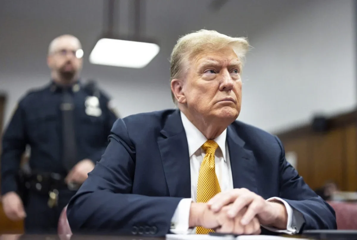 President Trump in courtroom with police officer