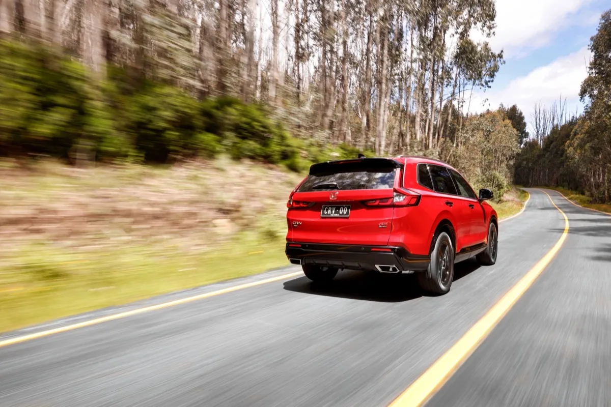 2026 Honda CR-V e:HEV hybrid in red rear three-quarter view
