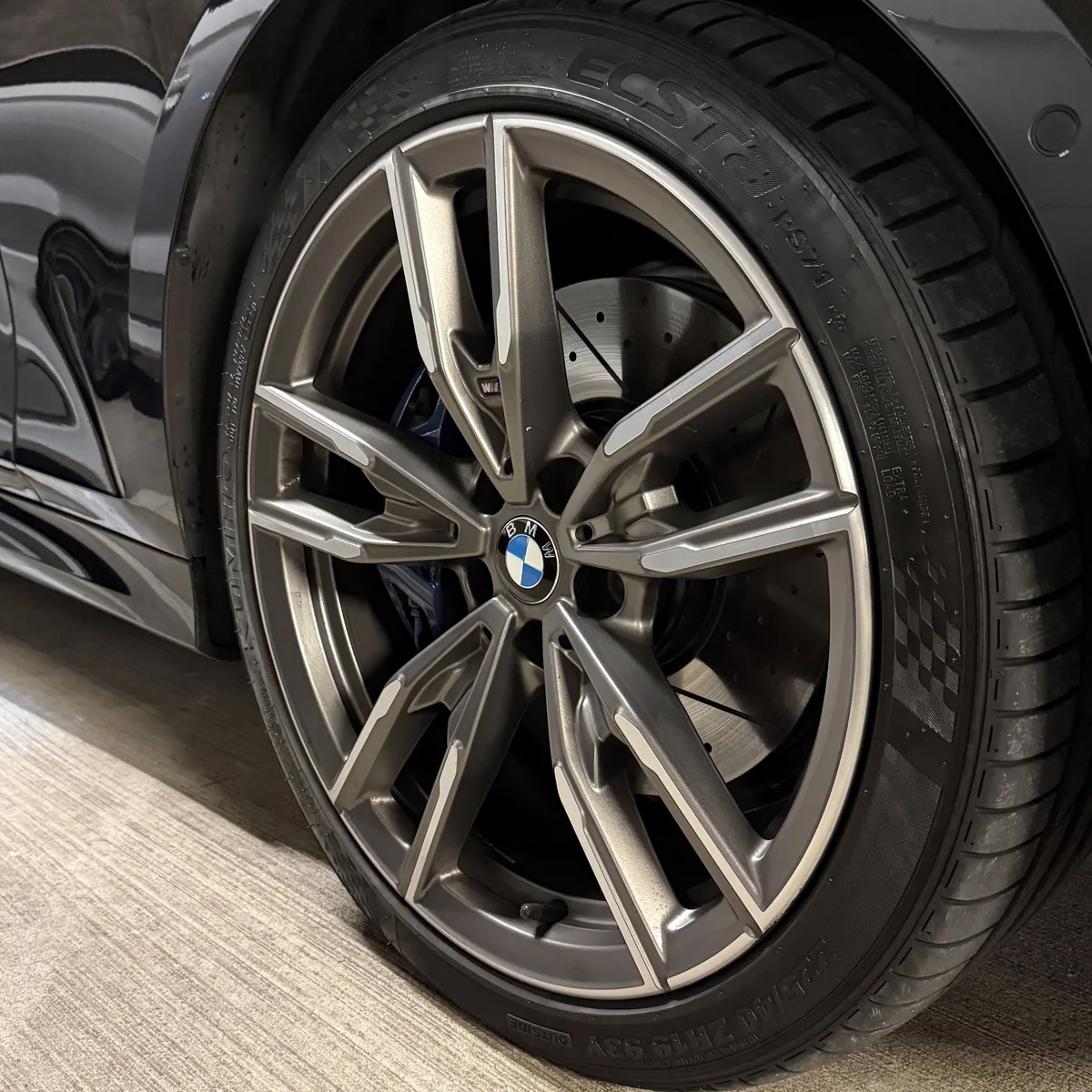 BMW X1 alloy wheel with multi-spoke design and blue brake caliper