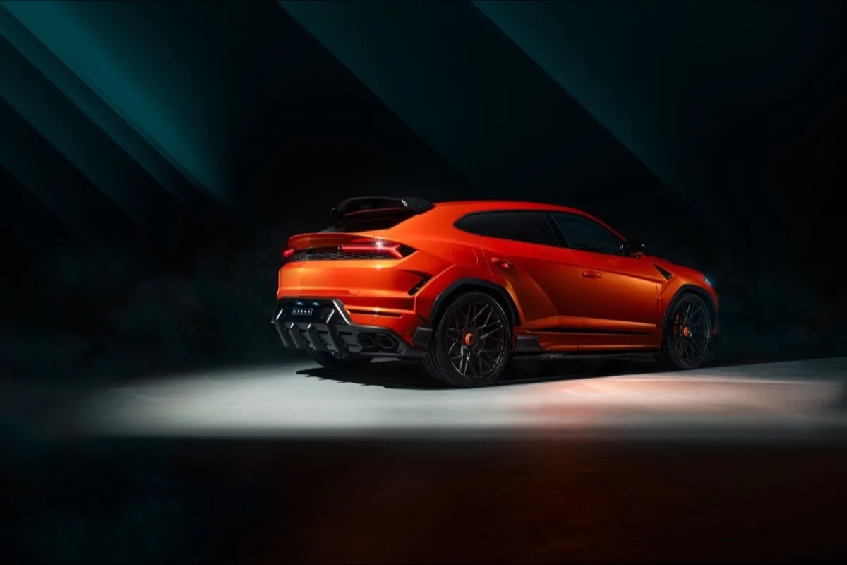 2026 Lamborghini Urus SE Widetrack full rear three-quarter view showing carbon diffuser and quad exhausts in dramatic studio lighting