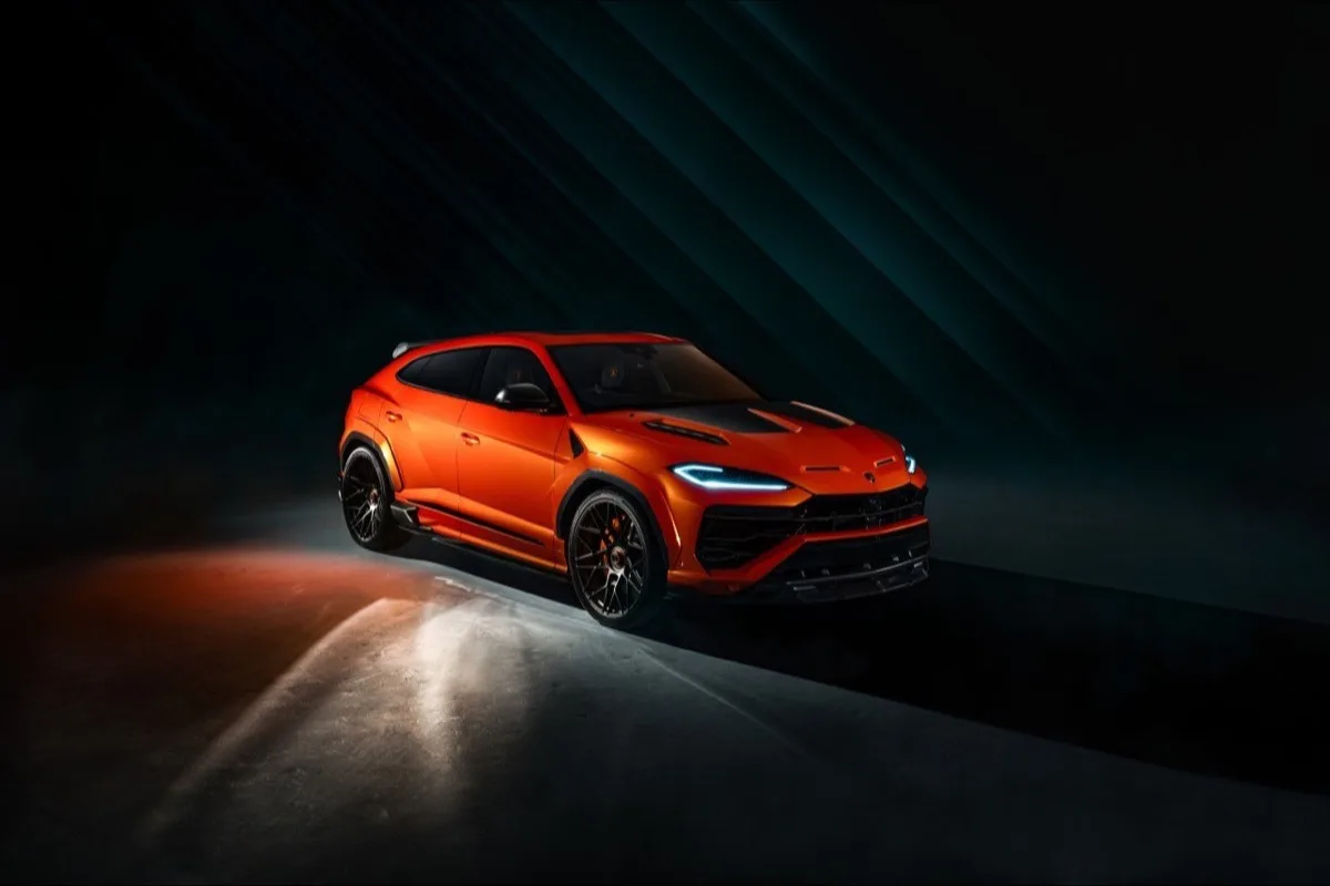 2026 Lamborghini Urus SE Widetrack high front three-quarter view showing full vehicle in dramatic diagonal lighting