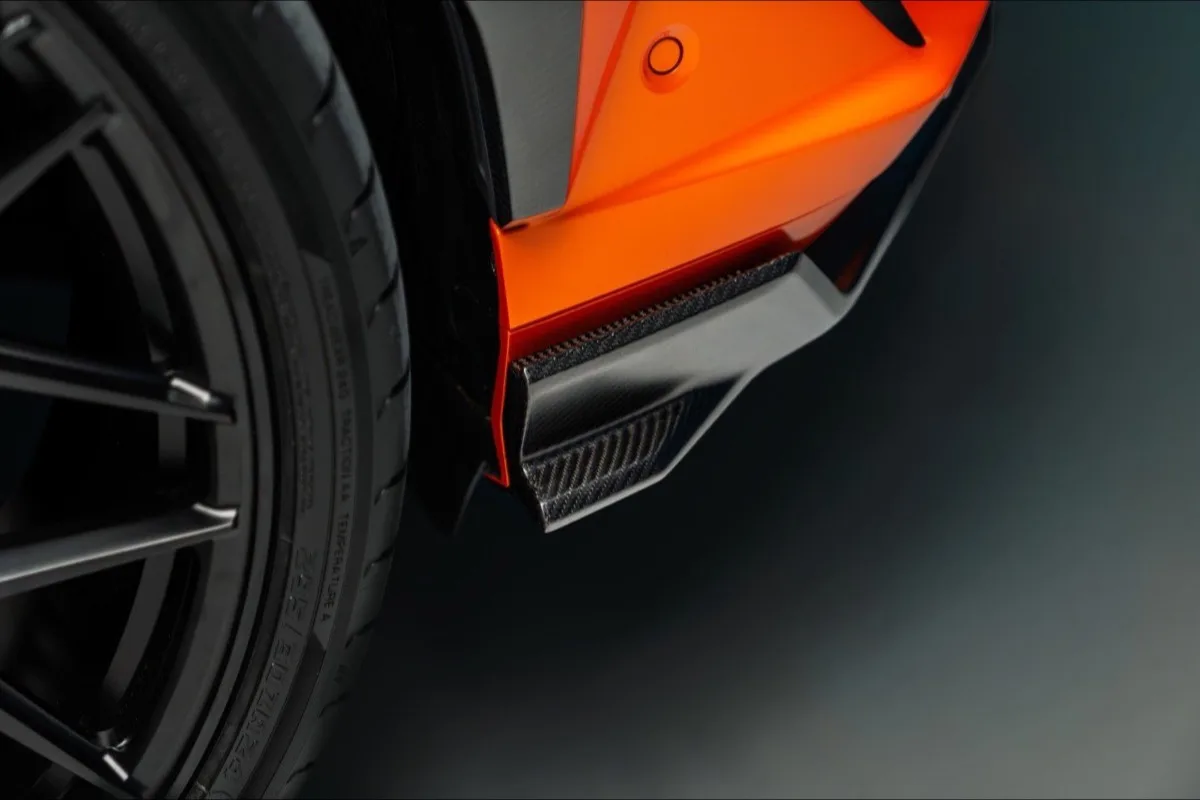 2026 Lamborghini Urus SE Widetrack extreme close-up of front splitter and canard at low angle