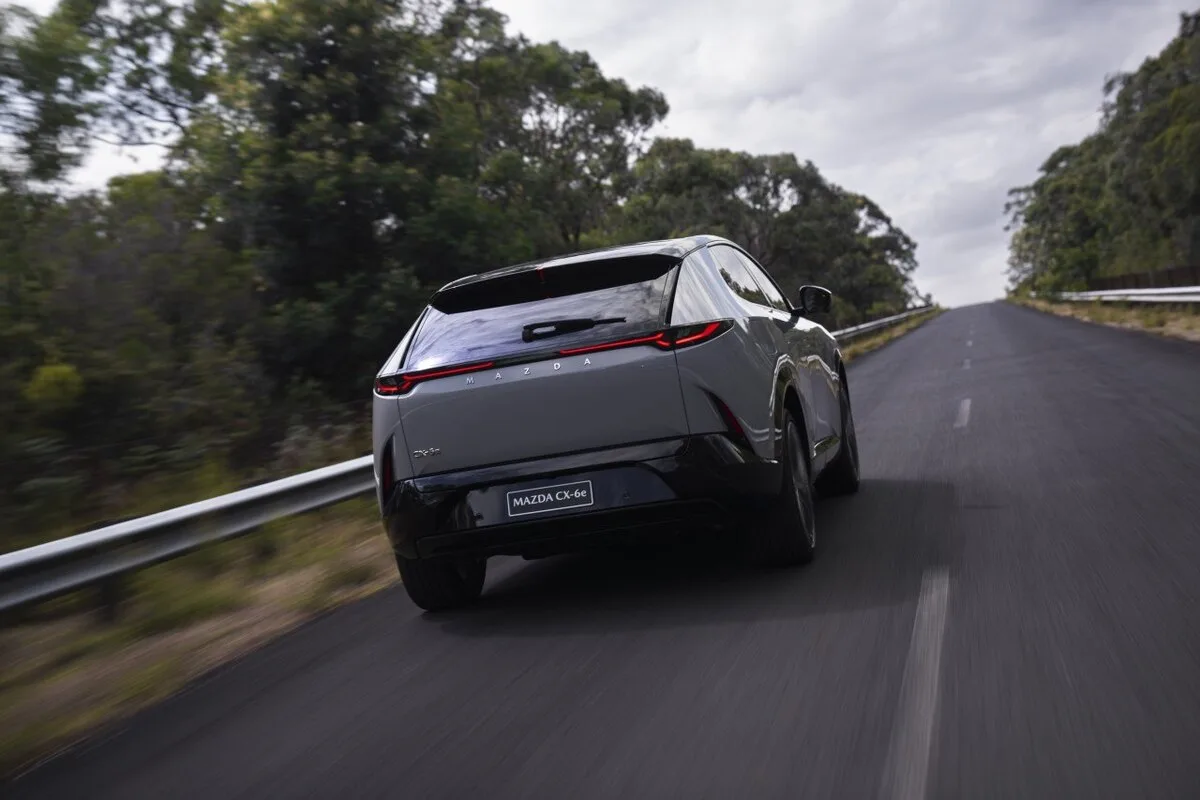 2026 Mazda CX-6e electric SUV rear view in grey on Australian road