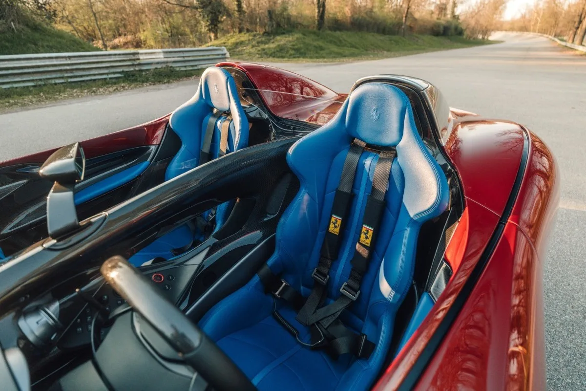 Ferrari Monza SP2 interior with Pelle Elmo Blu leather seats and four-point racing harnesses