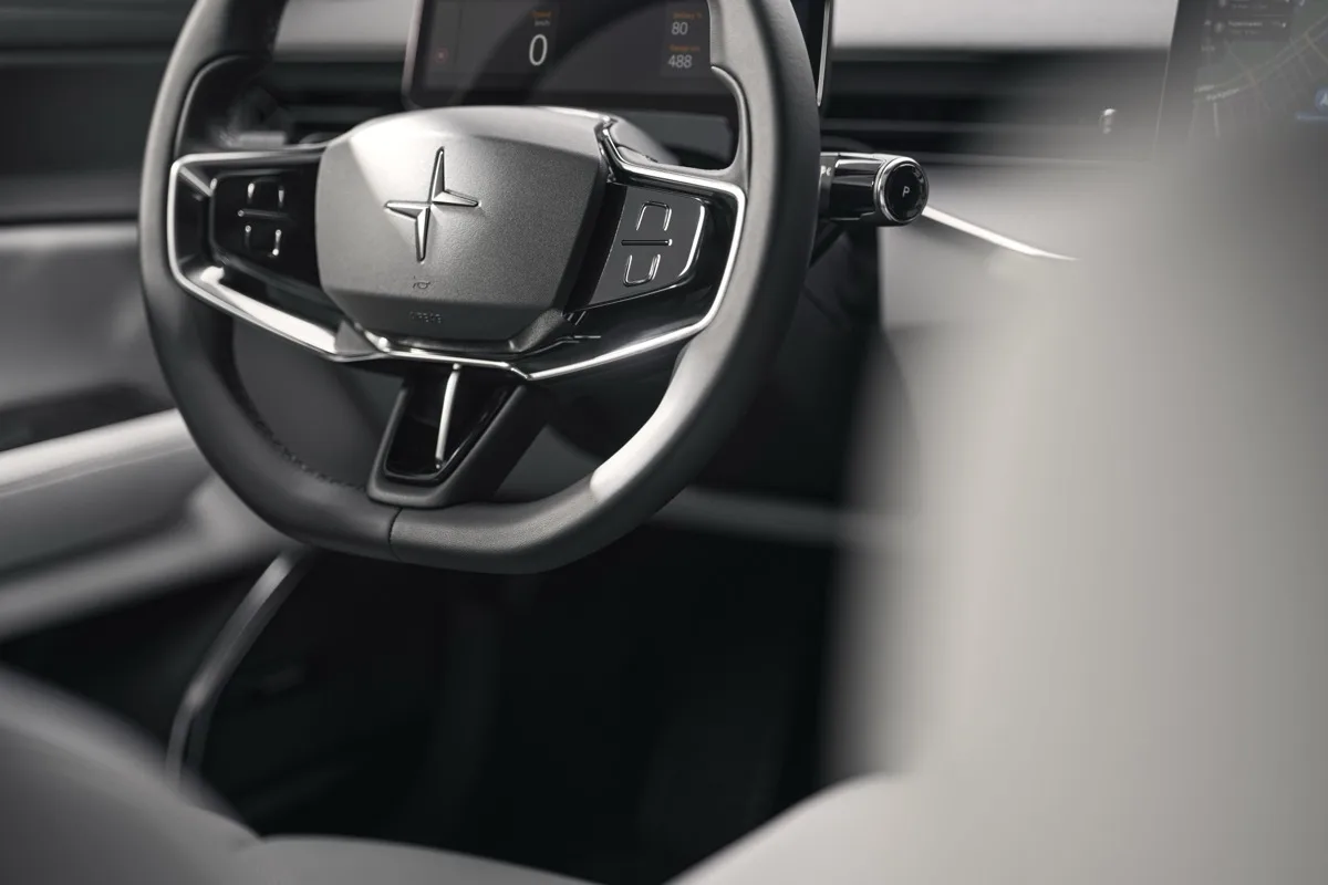 Polestar 5 steering wheel close-up with Polestar emblem and digital instrument cluster