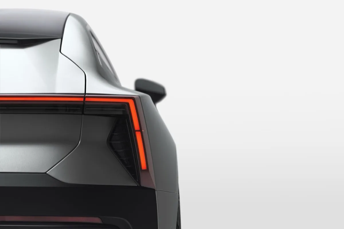 Polestar 5 rear quarter showing illuminated tail light and angular rear diffuser
