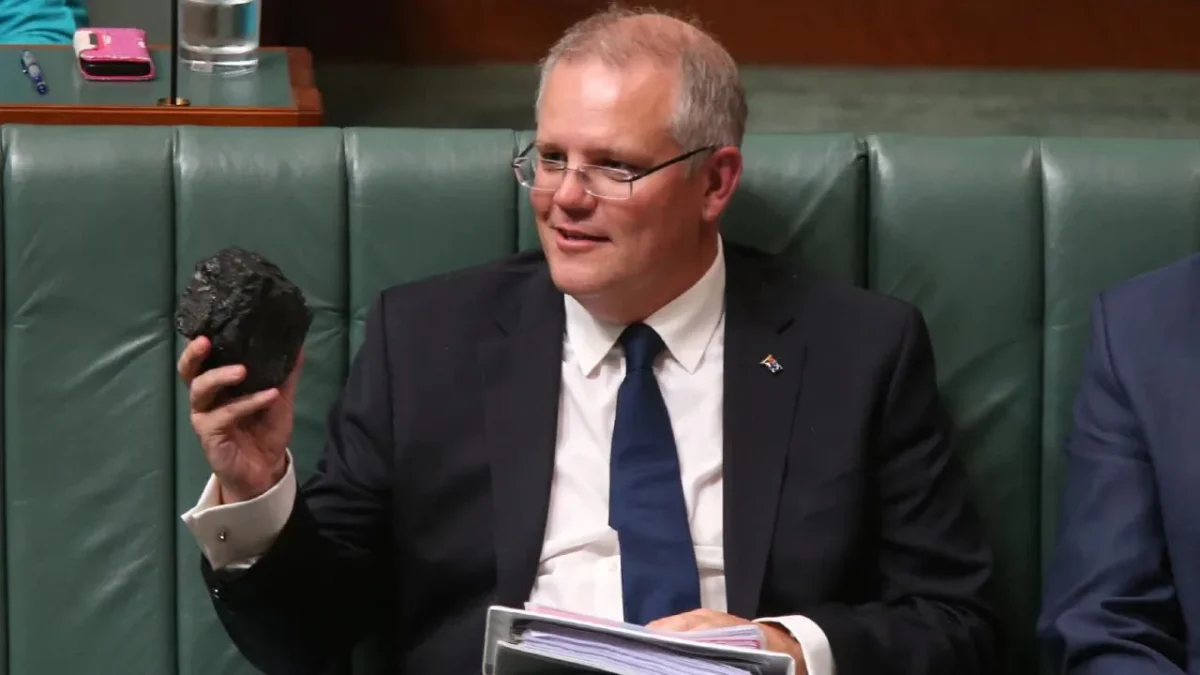 pm scott morrison mocking renewables by bringing a lump of coal into australian parliament 