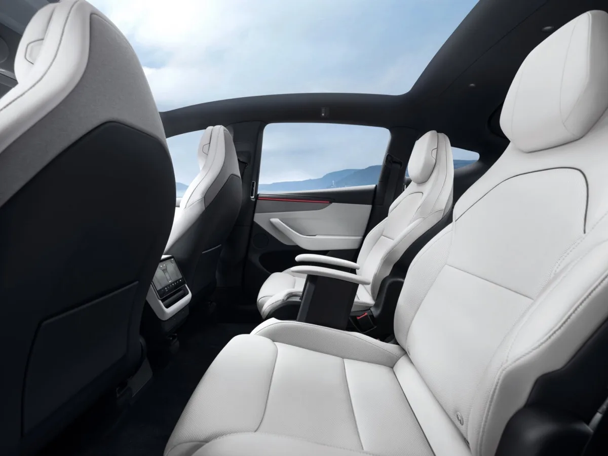 Tesla Model Y L second row rear seat with entertainment screen and ambient lighting