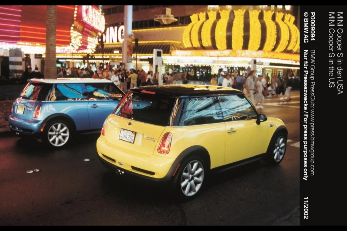 Yellow and blue MINI Cooper S models in Las Vegas at night 2002