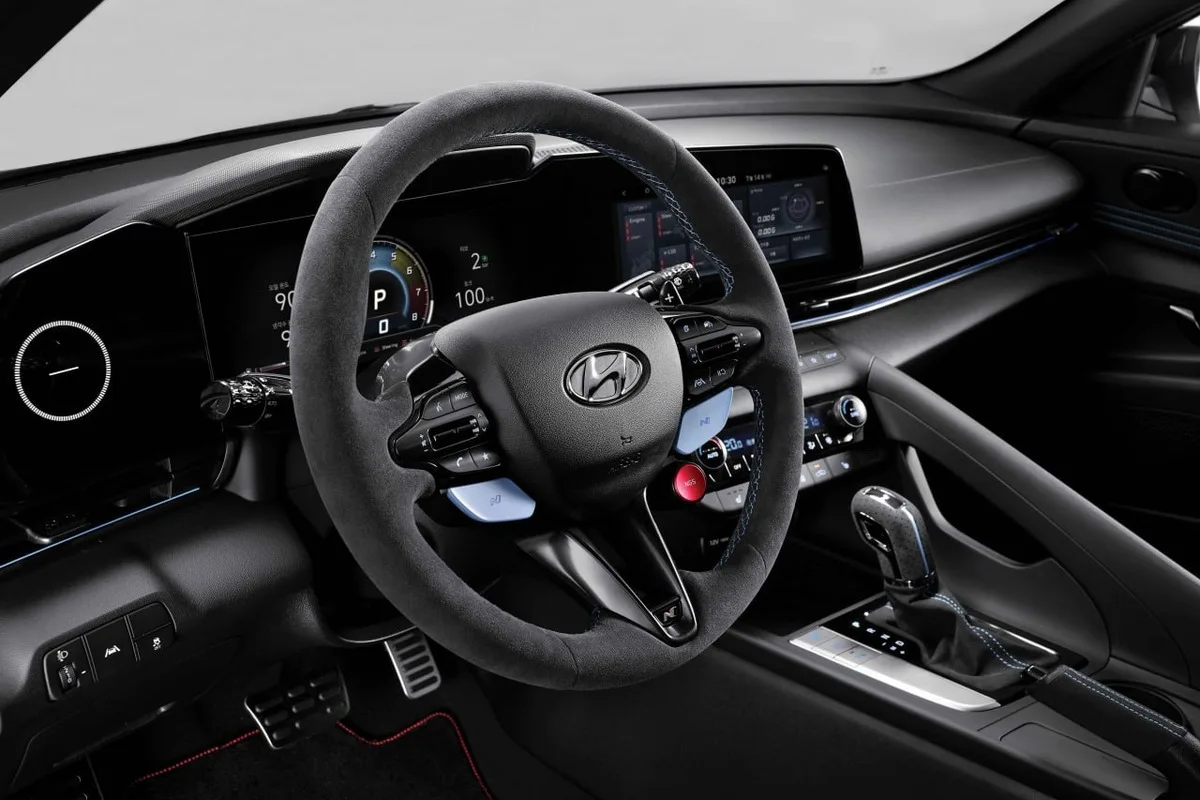 Hyundai N Alcantara steering wheel with blue stitching inside a Hyundai performance model