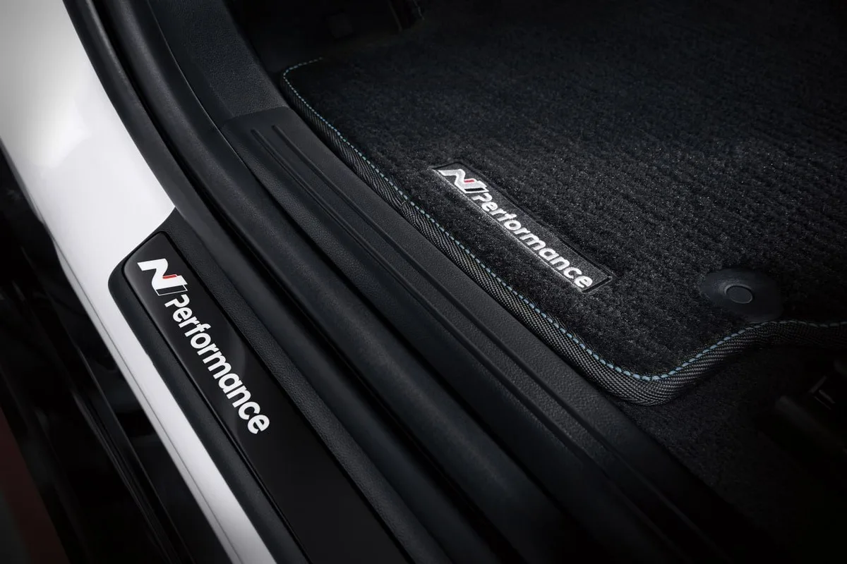 Hyundai N Performance floor mat and door scuff plate with blue stitching