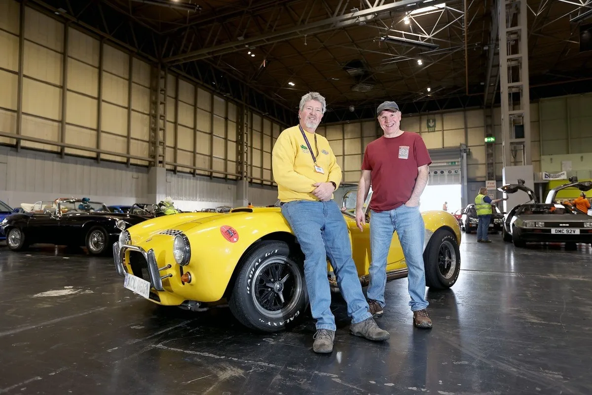 Sporting Bears members with yellow classic sports car at 2026 charity event