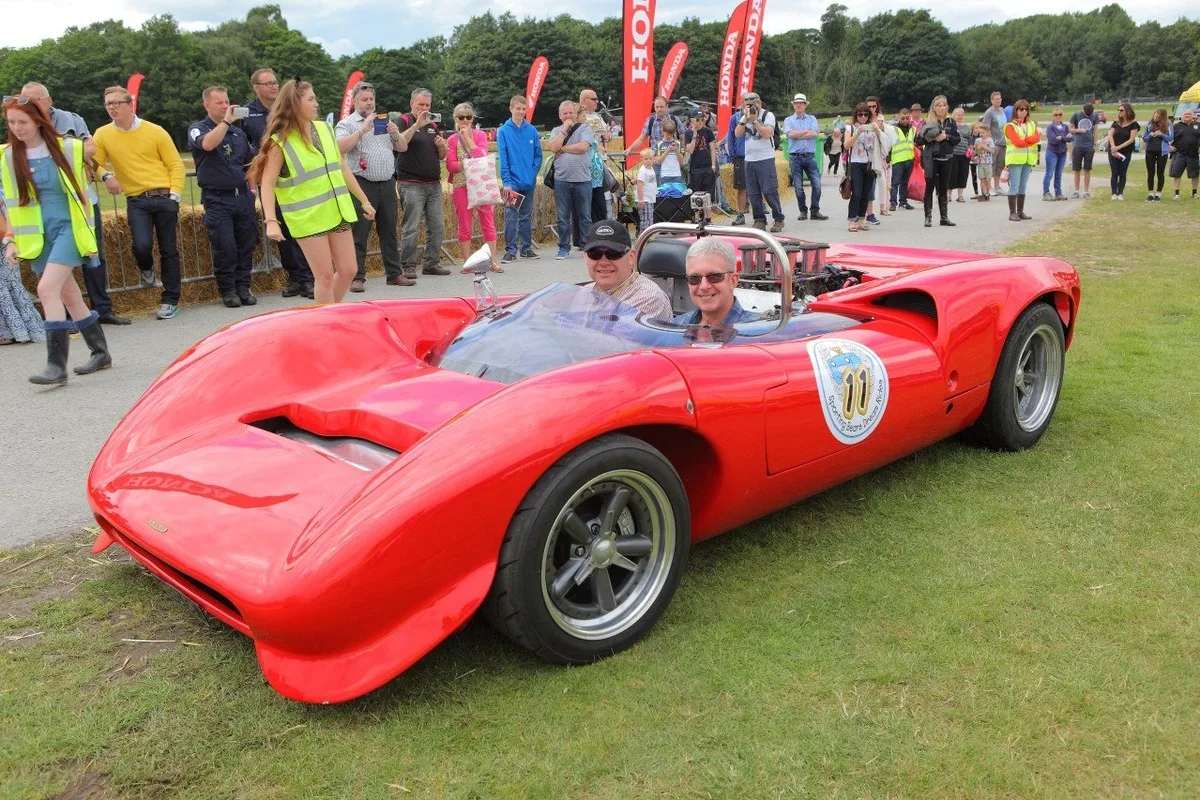 Sporting Bears red race style sports car giving charity ride in 2026