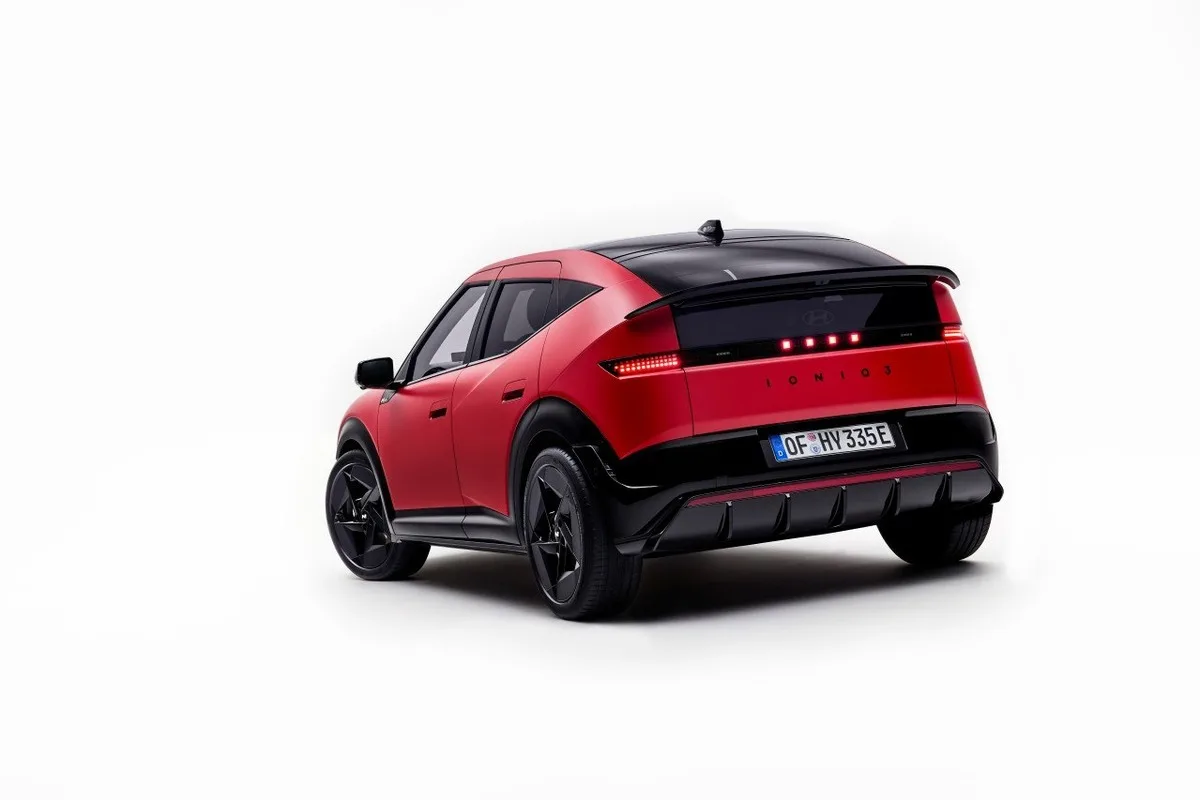 2027 Hyundai IONIQ 3 in red shown from the rear three-quarter angle