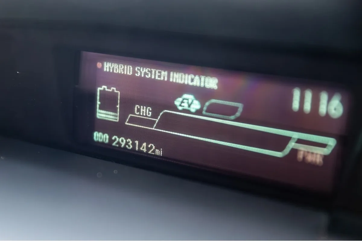 Toyota Prius dashboard odometer showing 293142 miles in eBay high-mileage research story