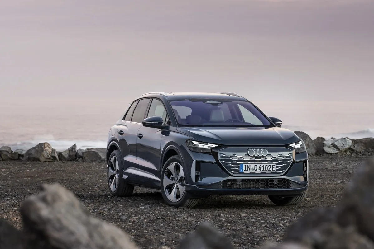 Audi Q4 e-tron parked on rocky coastal ground