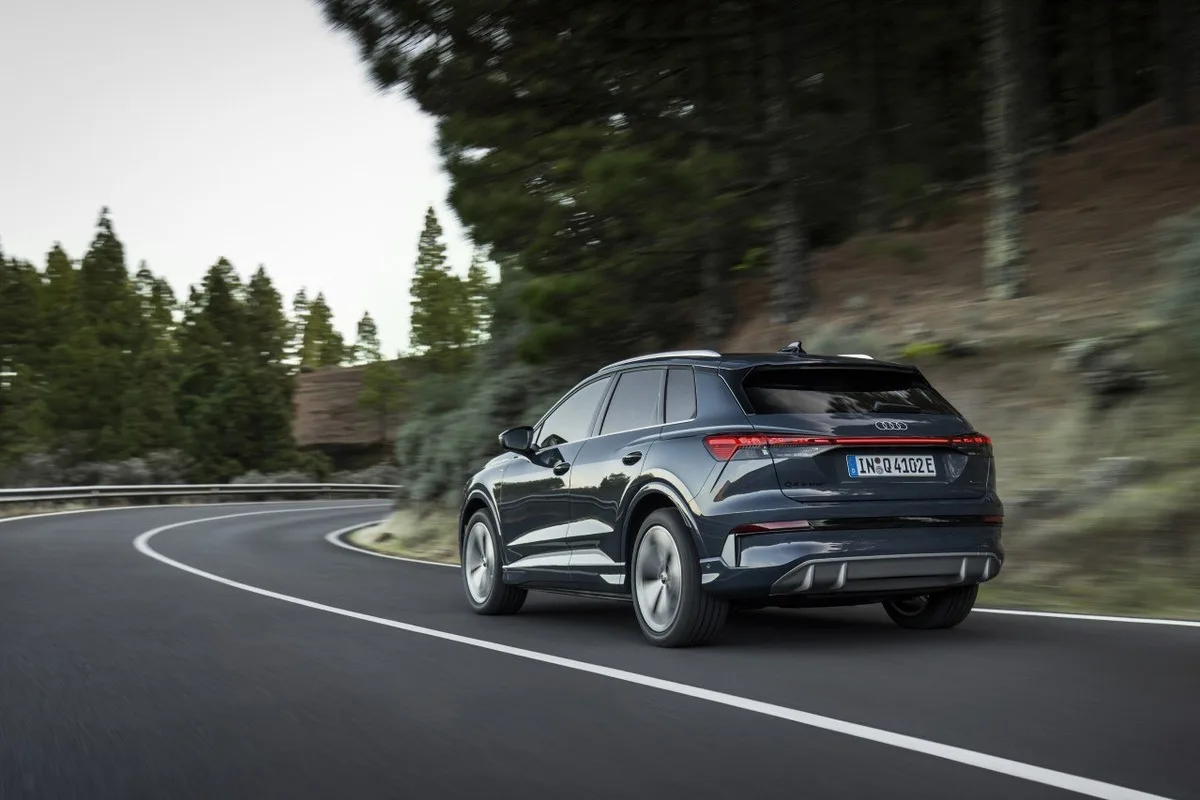 Audi Q4 e-tron driving on a forest road